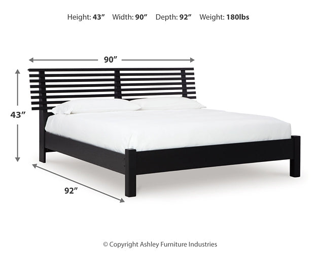 Danziar King Panel Bed with Mirrored Dresser